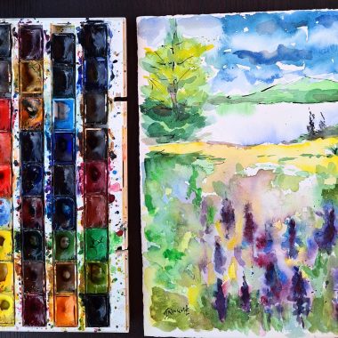 ציור מקורי: פלטת צבעי המים il_fullxfull.6360389208_qqgb.jpg המשומשת מונחת לצד ציור מלא חיים של עצים, אגם ופרחים תחת שמיים כחולים — השראה מושלמת לחובבי אמנות טבע מופשטת. מוסיף צבע וייחודיות לכל חלל.